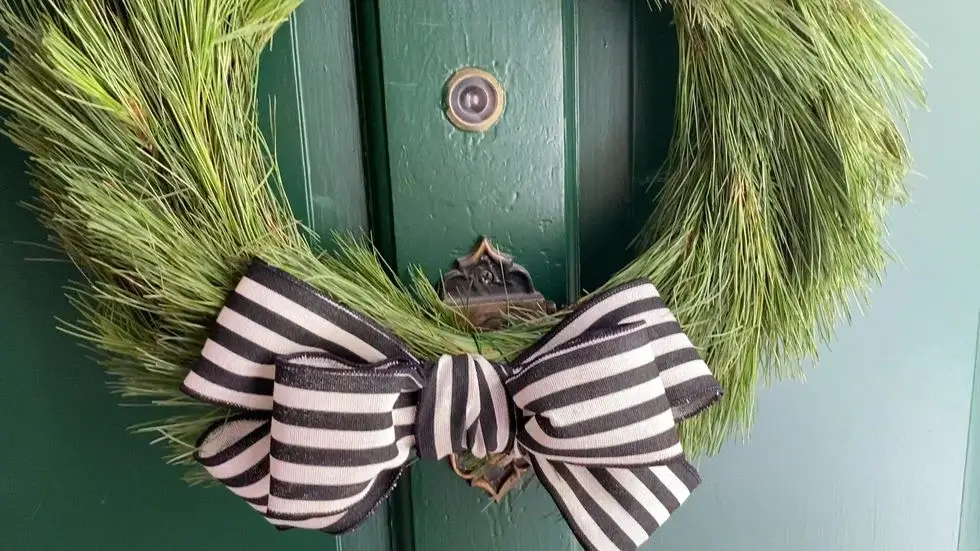 A large, perfectly fluffed bow with wired ribbon, an easy element of DIY Christmas decorations for adding to gifts or to wreaths.