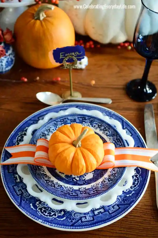blue and white with scattered pumpkins table decor