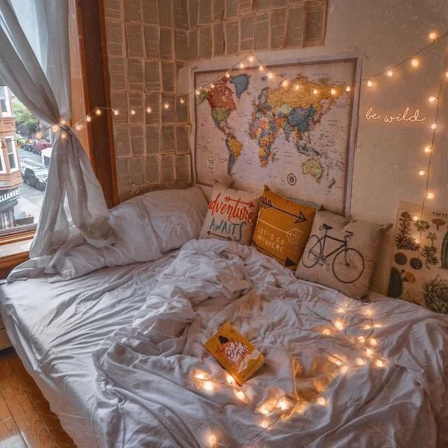 Cozy corner bed layout in a small couple's bedroom.