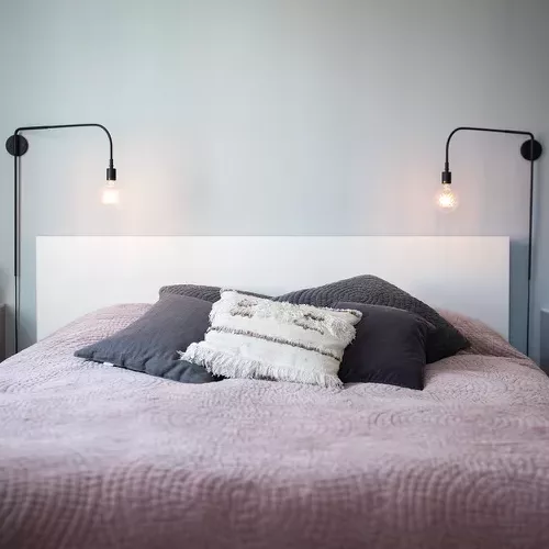 Minimalist couple bedroom with contemporary accents.