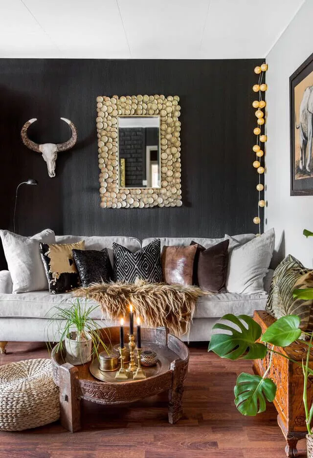 DARK BOHO LIVING ROOM WITH SKULLS AND LEATHER CUSHIONS