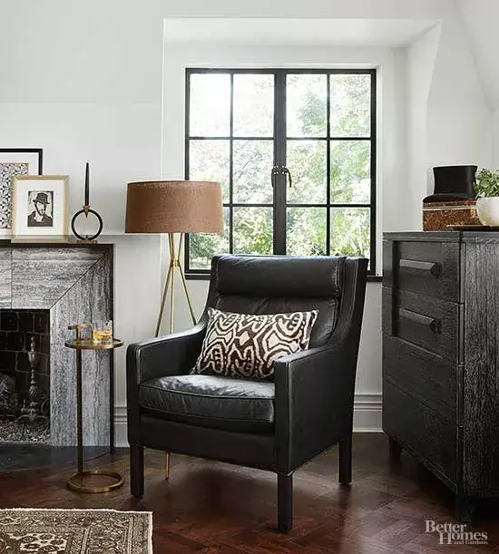living room with standing lamp and large window