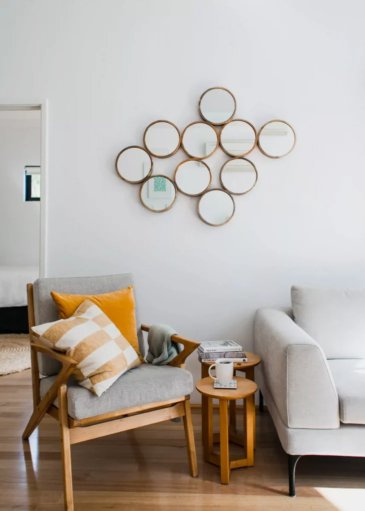 cluster mirrors on living room wall