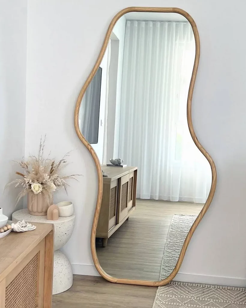 blob mirror in corner of bedroom for home styling