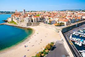 The picturesque harbor of  Antibes on the French Riviera with boats and stunning buildings
