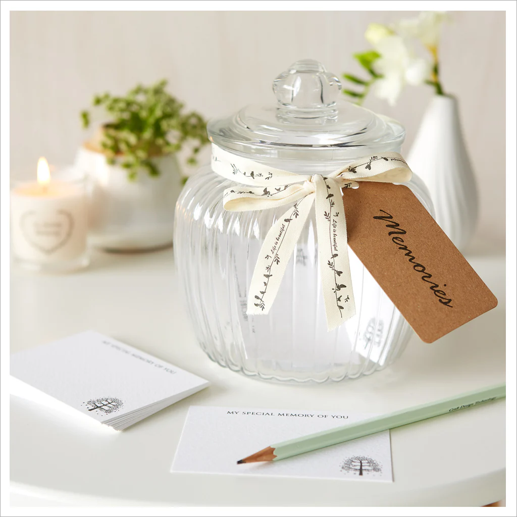 new year traditions memory jar image from https://www.angelanddove.com/products/glass-memory-jar-funeral-remembrance-cards
