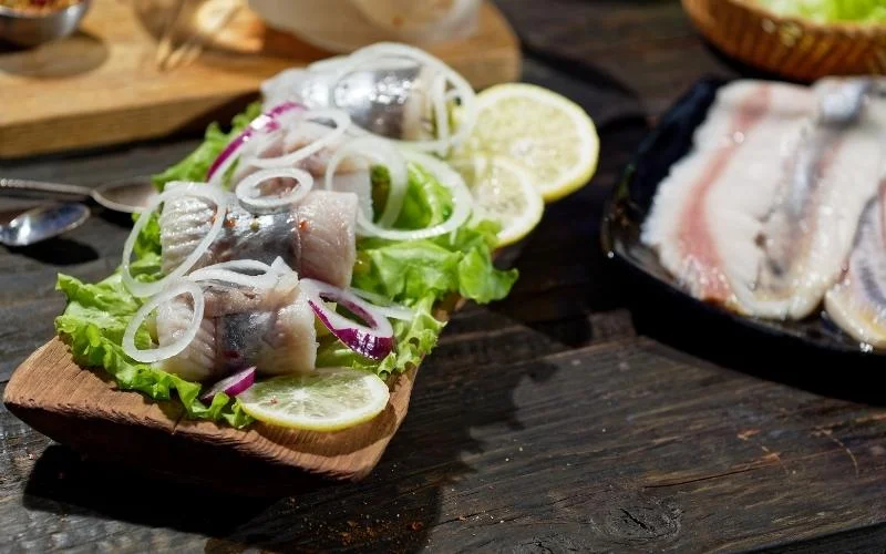 new year traditions around the world pickled herring image from https://yummybazaar.com/blogs/blog/guide-to-german-seafood