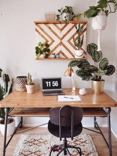 stylish a desk with small plants as inexpensive home decor