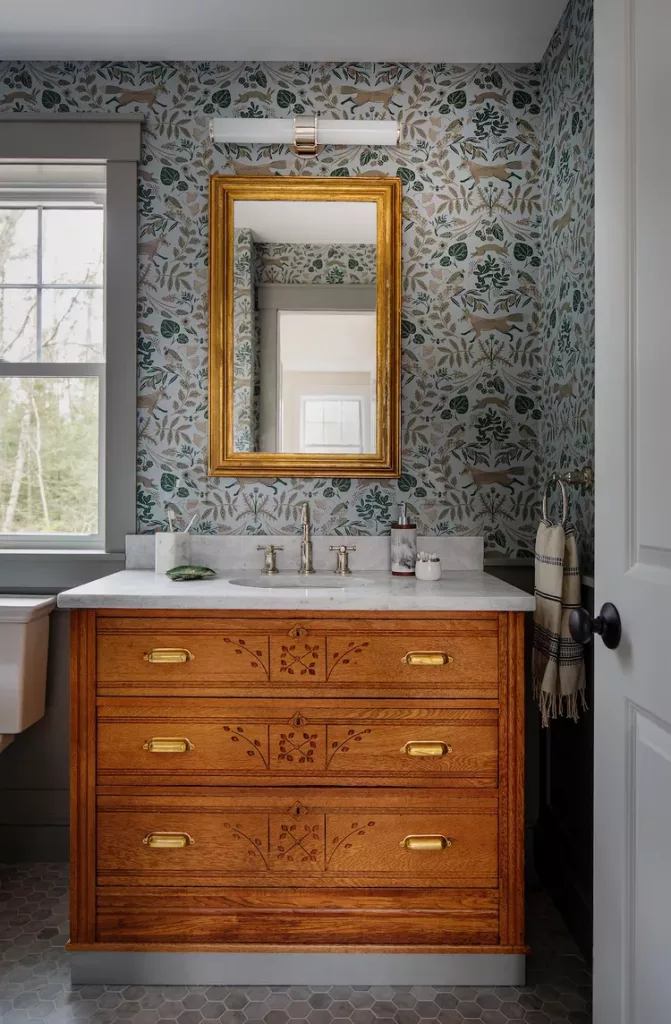 Retro bathroom decor featuring reclaimed vintage vanity and retro lighting