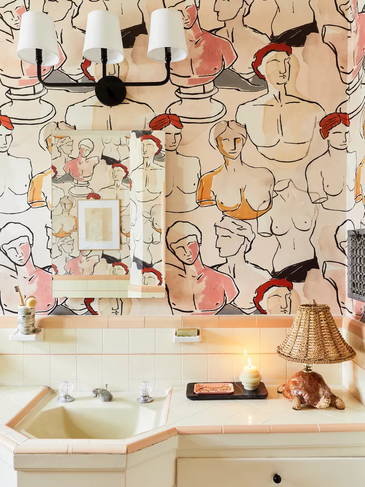 Bathroom ideas combining white and pink tiles with bold vintage wallpaper