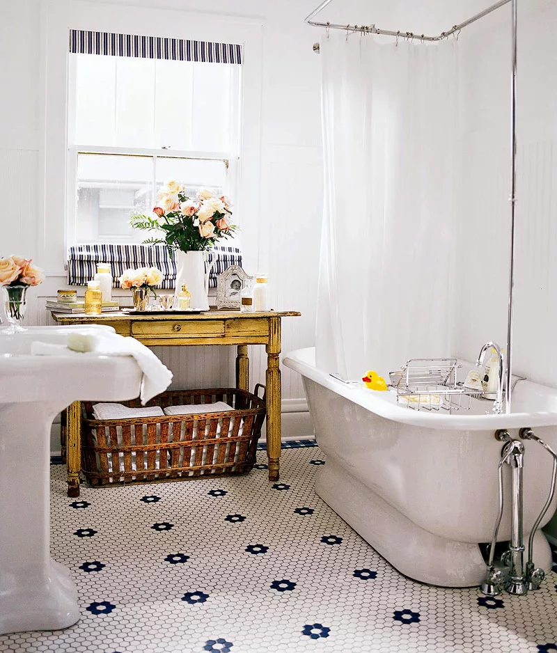 Vintage bathroom featuring a classic clawfoot tub and checkerboard penny tiles – timeless bathroom ideas