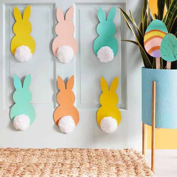Colorful DIY Easter decorations for the home - Easter rabbit decor featuring cardboard and pom-pom bunnies