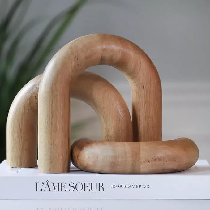 japandi inspired smooth wooden arches for decor on living room shelves