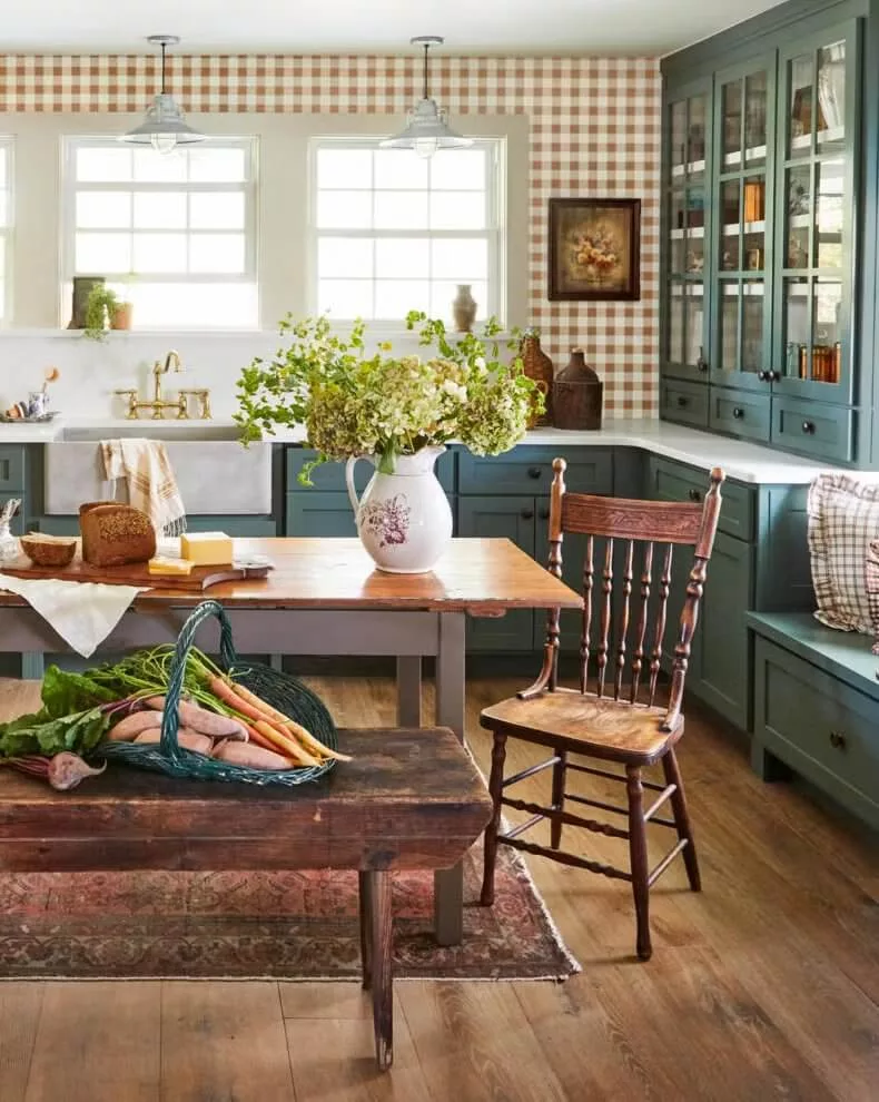 checkered wallpaper and warm toned green cabinets in a farmhouse style kitchen