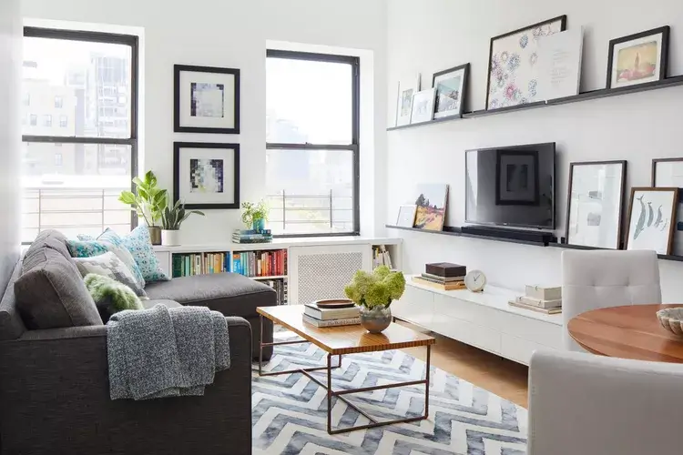 A beautiful gallery wall on  living room shelves 
