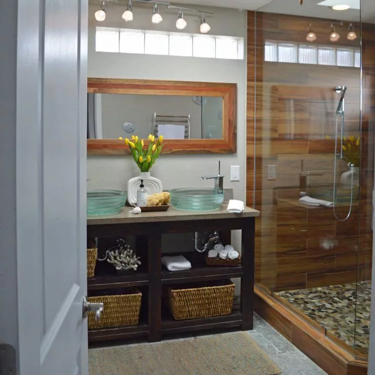 tulips in white vase in a bathroom