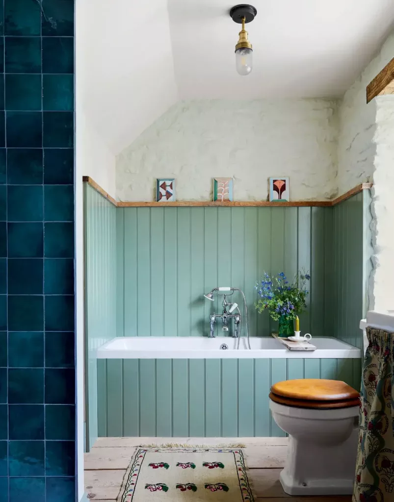 vintage tiles on a small ledge above the bath
