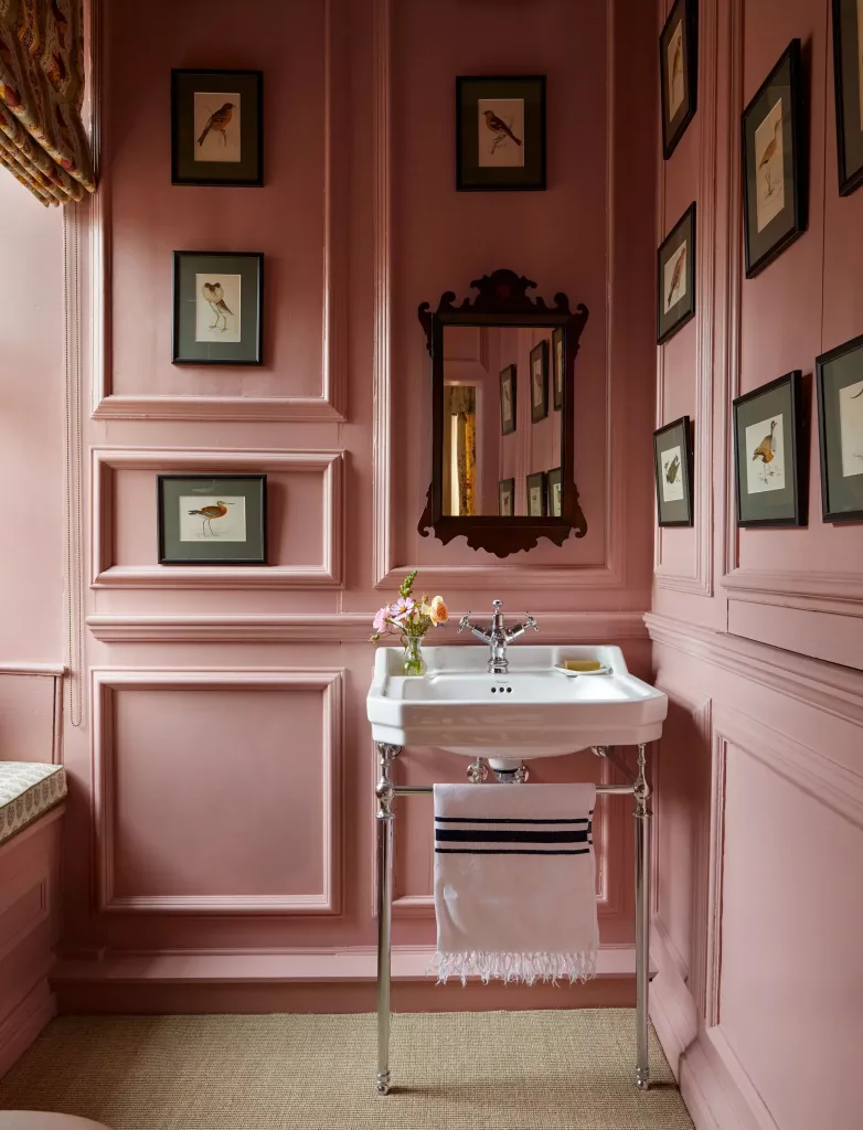 pink bathroom with gallery wall