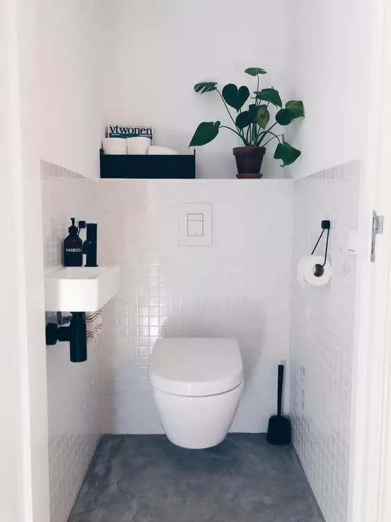 black and white toilet with built in shelf