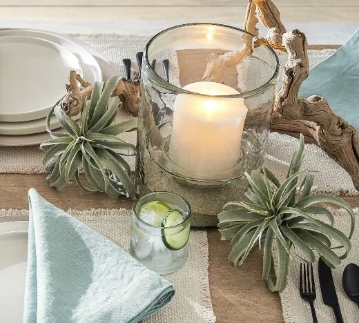 driftwood and candles as dining table decor for a summer table