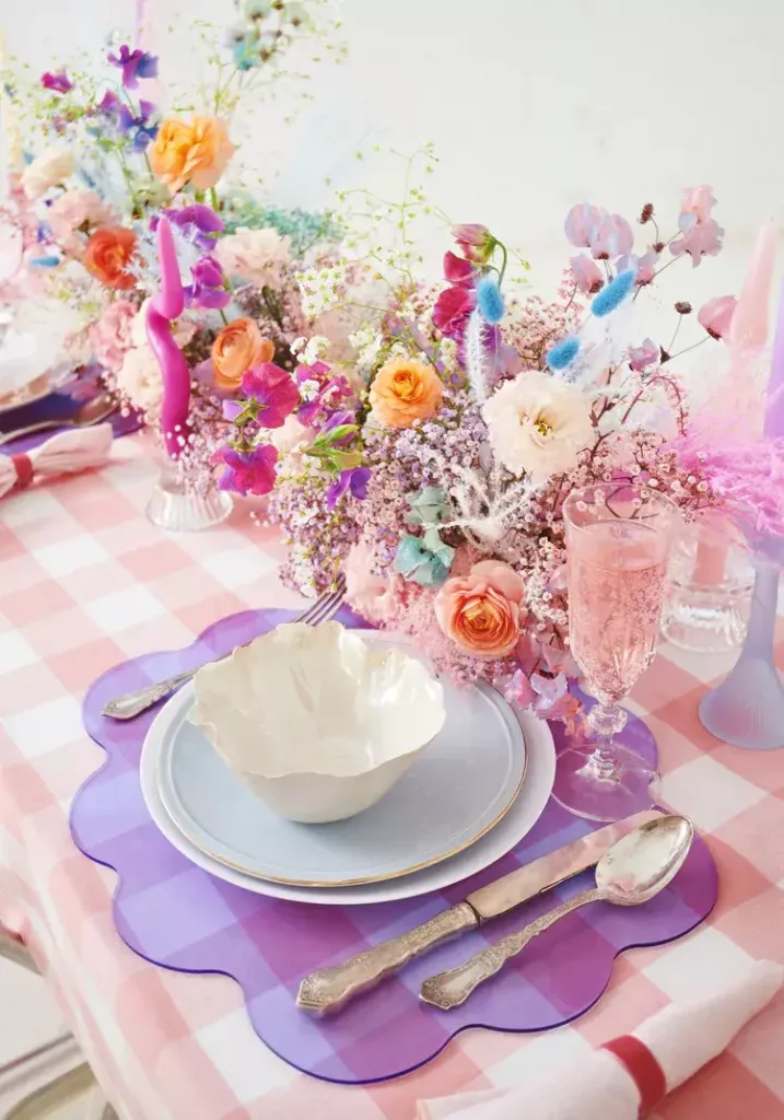 summer dining table decor of an abundance of flowers as table decoration