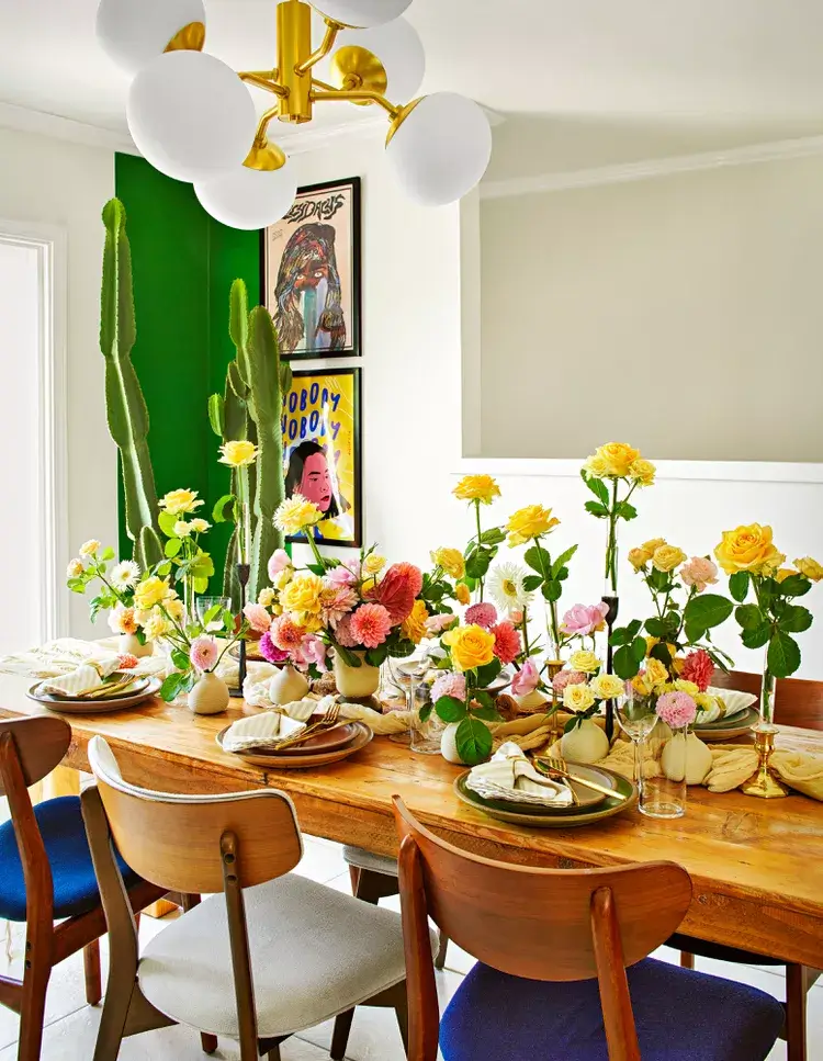 flowers and simple vases decor on a summer inspired dining table
