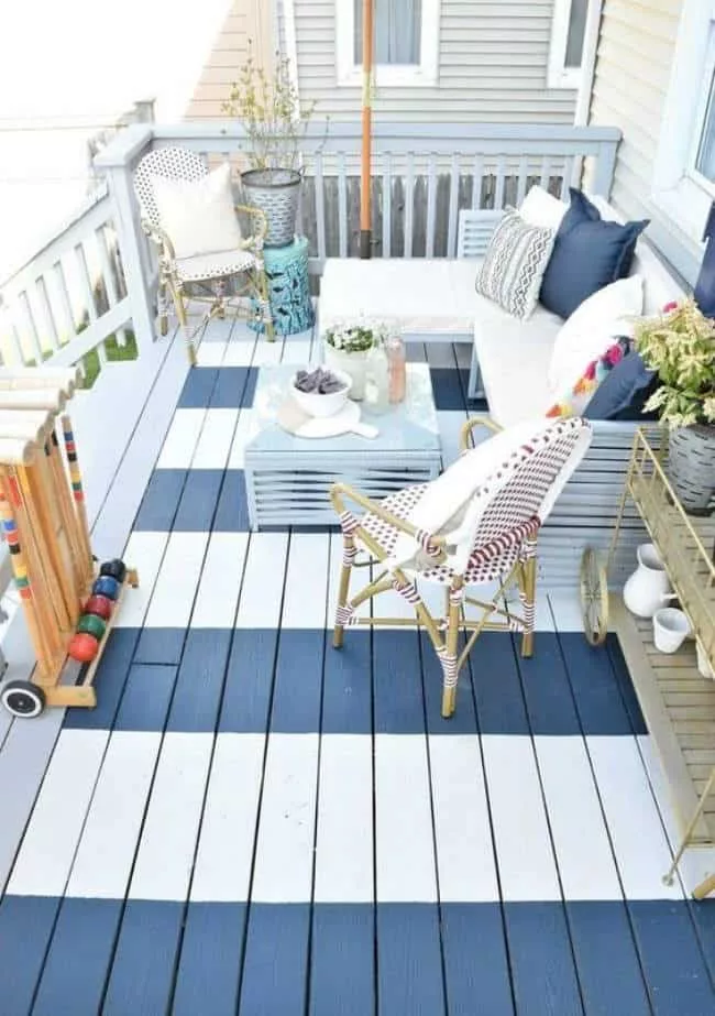 painted deck with thrifted porch decor to mix modern and vintage