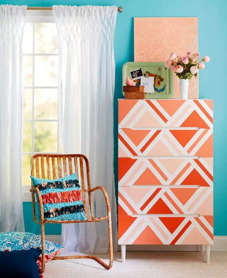 dresser painted with patterns and colorful paint