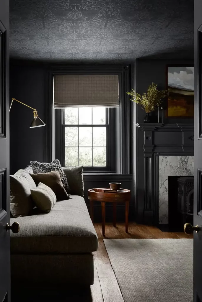 Black wallpapered ceiling making a dark and bold statement in the living room