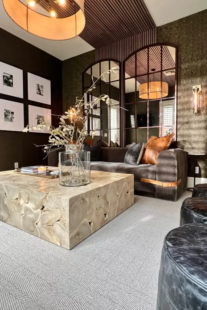 Dramatic dark wood slatted accented ceiling in lounge area