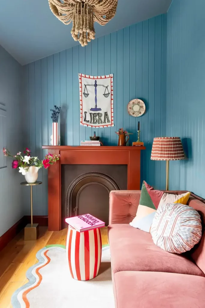 Light blue ceiling colors in a cozy living room with a sloped ceiling