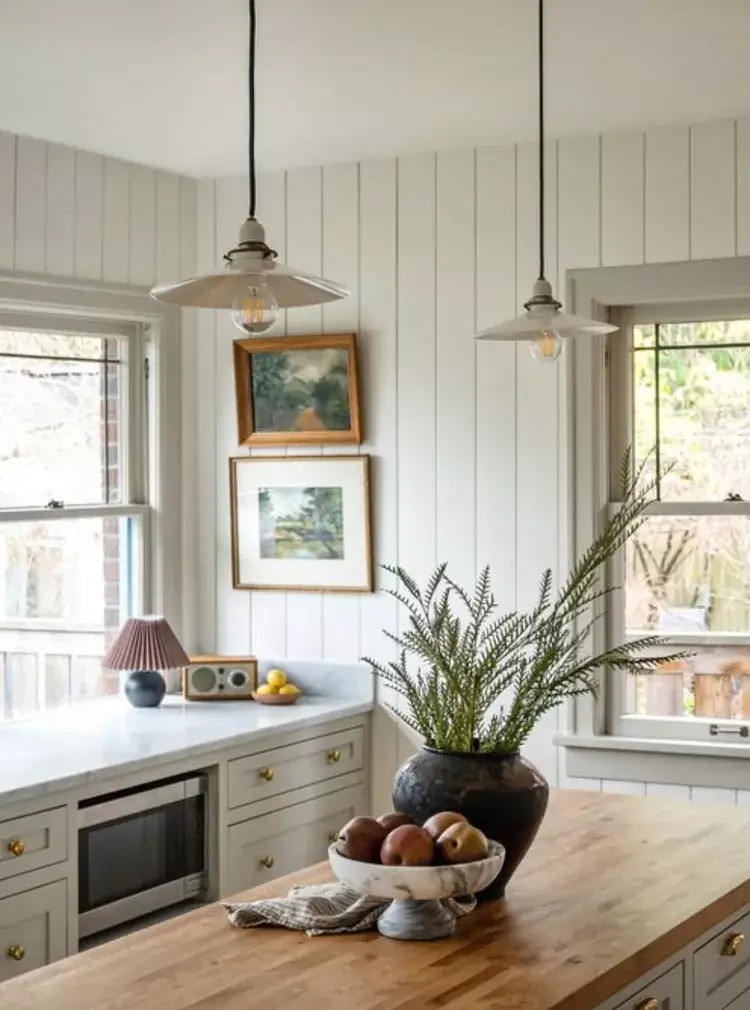 Kitchen counter decor featuring a vintage lamp, radio, and fruit bowl—beautiful things that elevate everyday home styling.