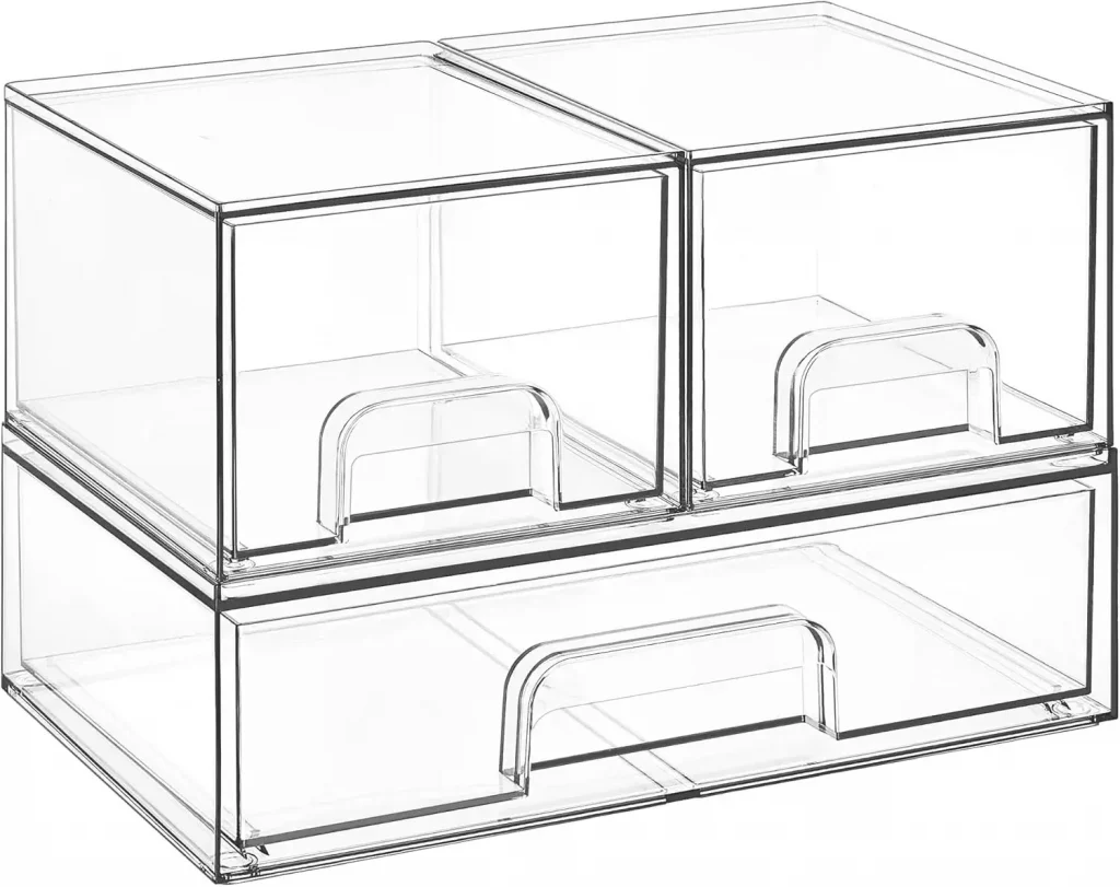 Small space organizers with clear stackable bins storing toiletries and school supplies in a dorm room