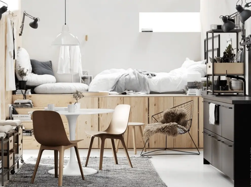 studio apartment lighting layout that uses lighting to define each area.