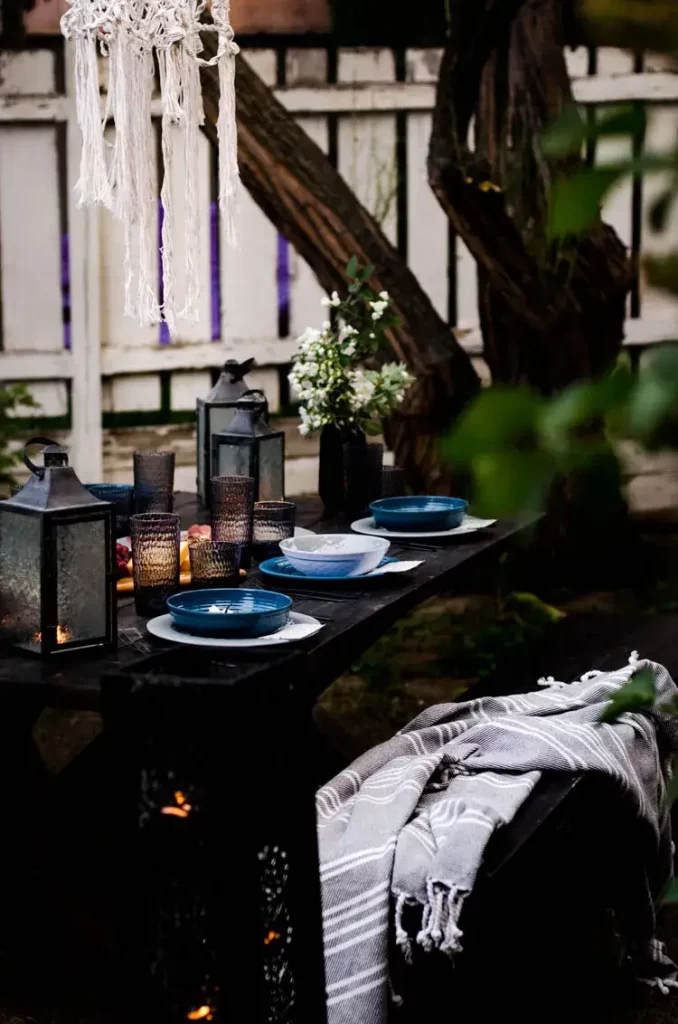cozy winter patio lit with lanterns