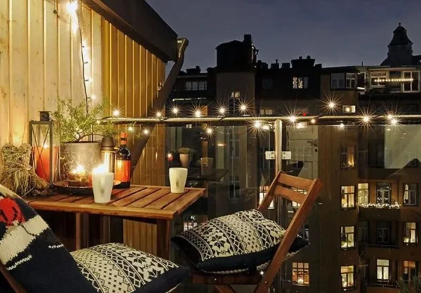 inner city balcony with slim table on a winters nights