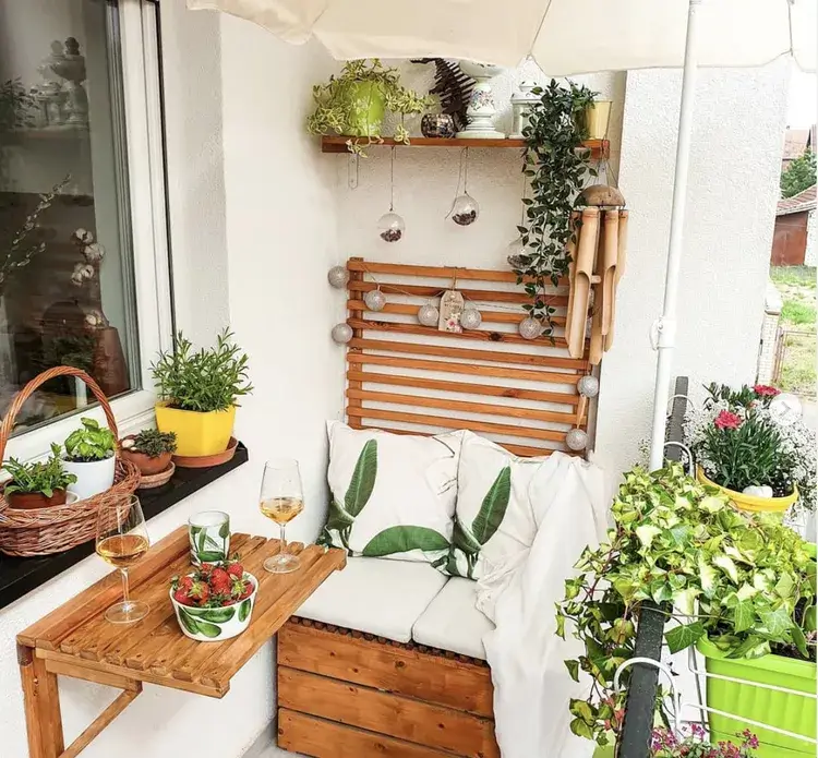 small balcony with versatile furniture ready to be a cozy winter patio.