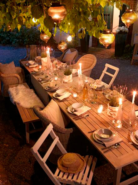 table set with candles lighting the space