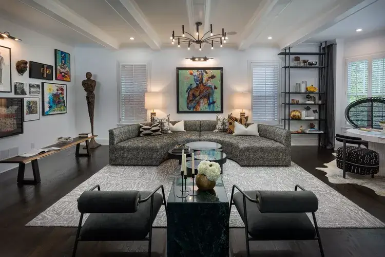 black and white living room design enhanced by layered lighting