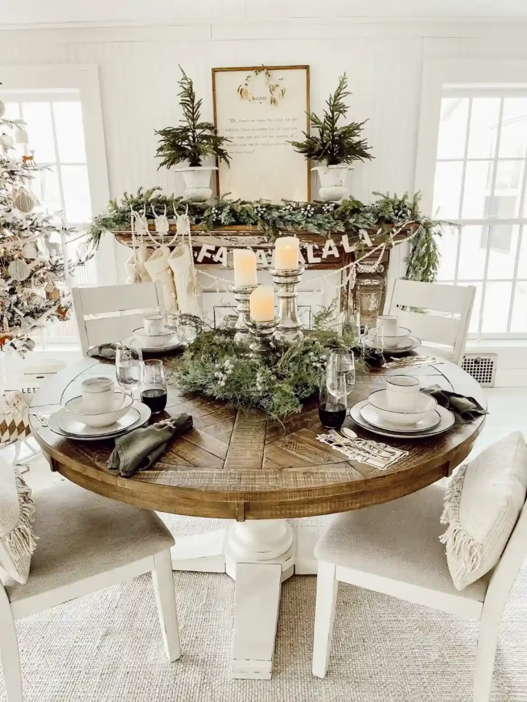 Elegant Christmas table decorations in a small space, coordinating with the room's existing holiday season decor for a cohesive look.