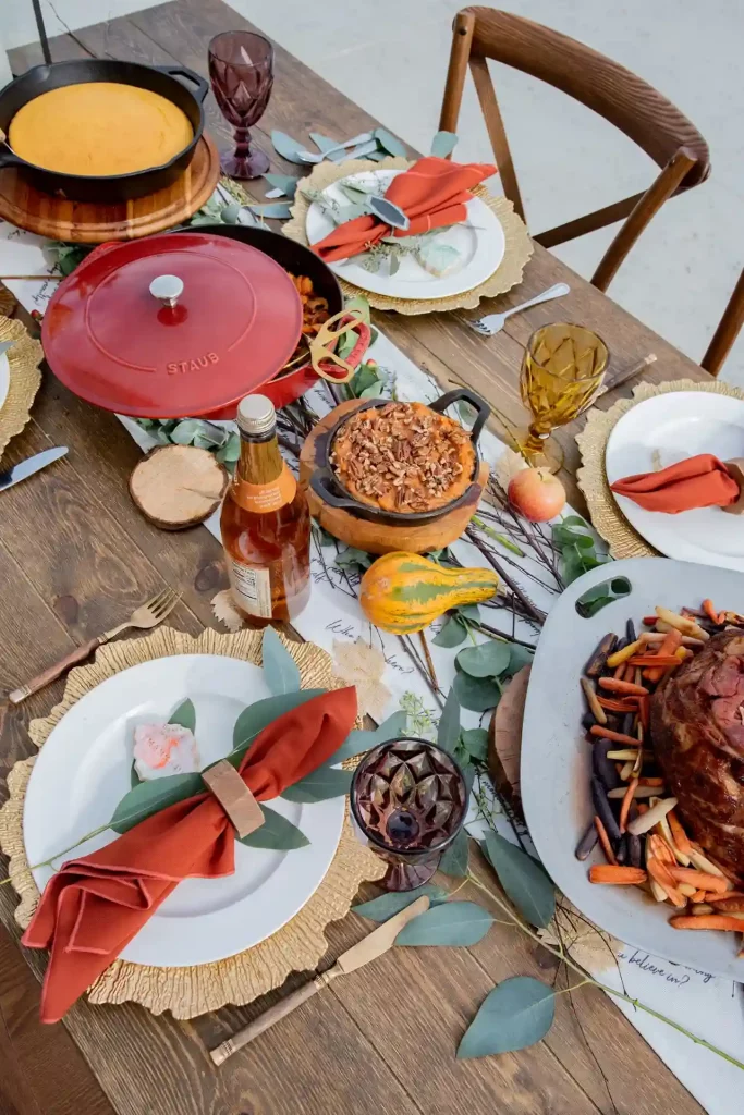 Holiday table setting ideas using natural serving dishes and food as the festive table decor for a Thanksgiving holiday party.