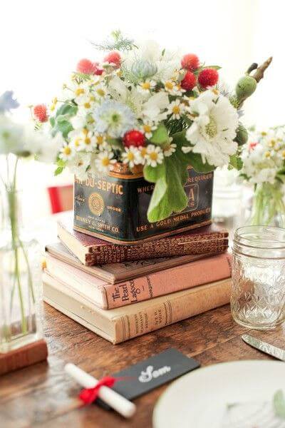 Vintage books and flower centerpiece for romantic table décor