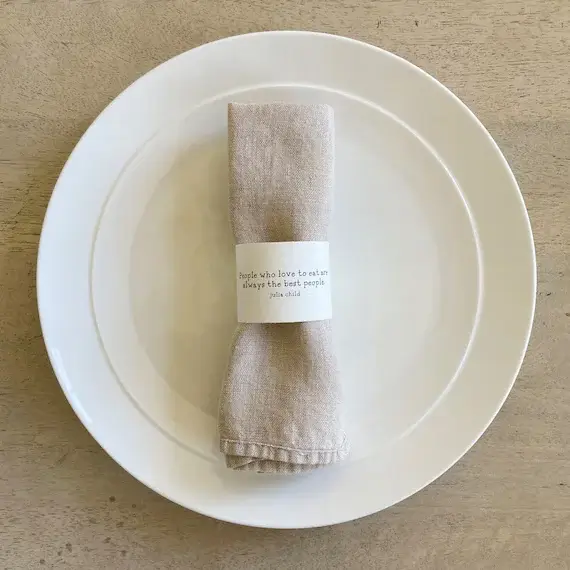 Printed love quotes as napkin rings for Valentine’s dinner décor