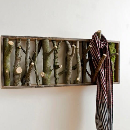 Functional foraged home project: a tree branch repurposed as a unique, free home decor coat rack.
