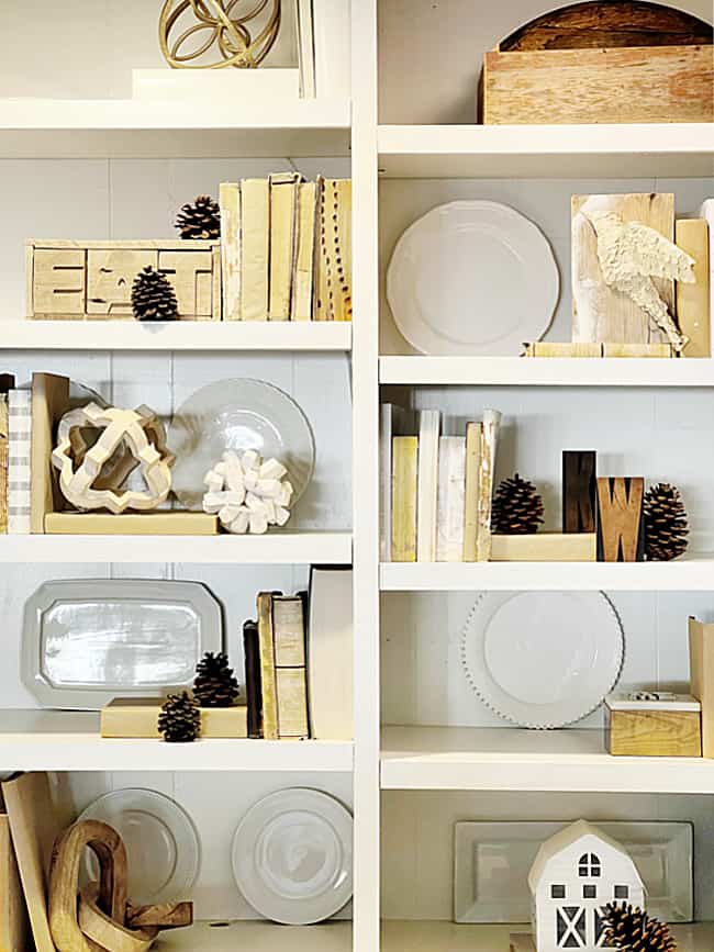 Free home decor idea: foraged pinecones arranged on rustic wooden shelves as natural elements in interior design.