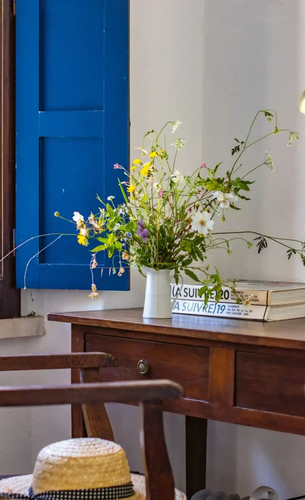Spontaneous free home decor: a rustic vase holding a fresh bouquet of gathered wildflowers.