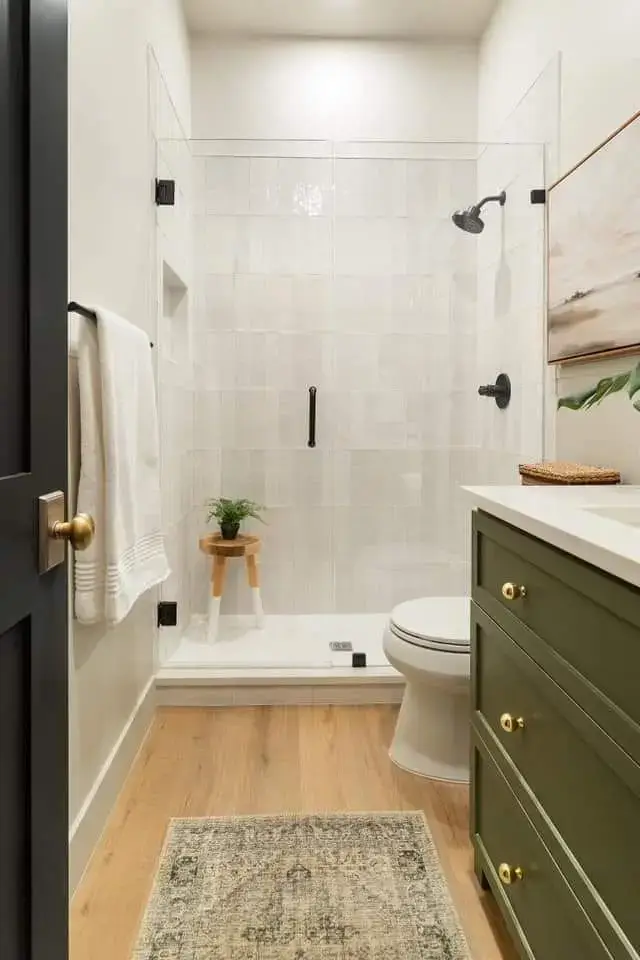 fern in the shower on a stool