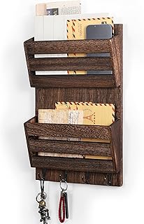 Wall-mounted organizer providing slim hallway furniture storage for keys and mail in a small entryway.