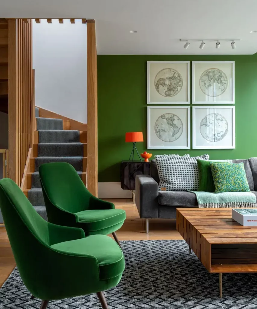 A bold, dark wall is home to a collection of monochrome old-world maps in black and white.