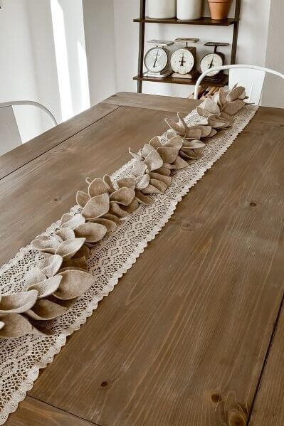 table decor with lace and felt garland runner
